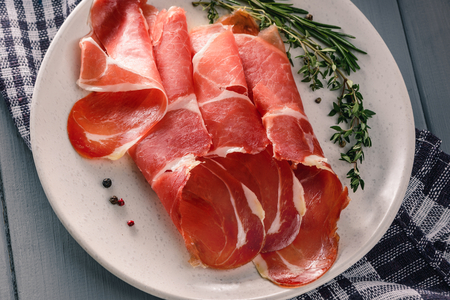 Thin slices of jamon ibericoの写真素材