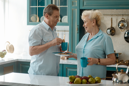 Retired couple having a breakfastの写真素材