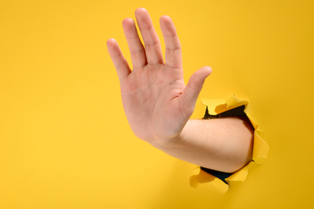 Hand showing stop gestureの写真素材