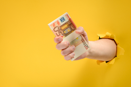 Hand giving banknotes