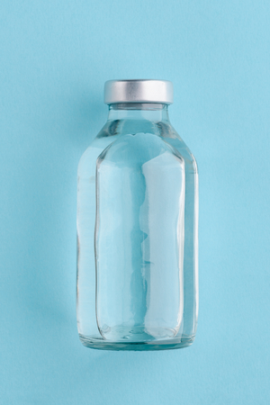 Medical bottle on blue backgroundの写真素材