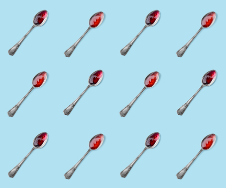 Spoon with raspberry jamの写真素材