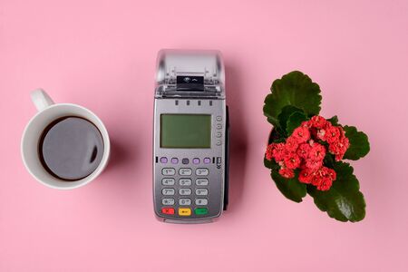 Coffee, flower and POS terminalの写真素材
