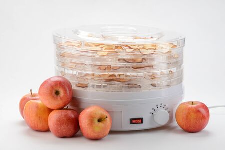 Whole apples and a dehydratorの写真素材