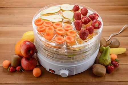 Food dehydrator filled with fruitsの写真素材