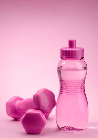 Bottle and dumbbellsの写真素材