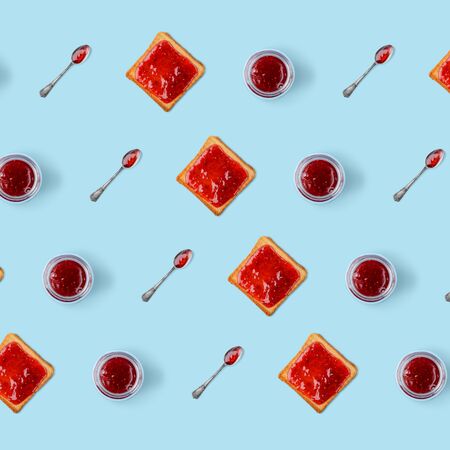 Toasts, jars of jam and spoonsの写真素材