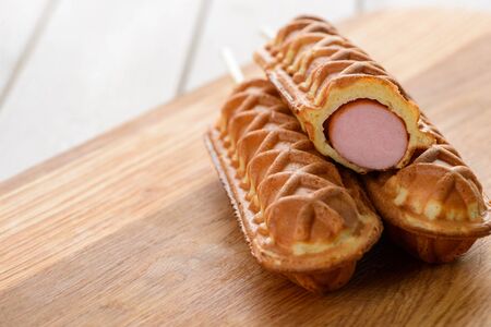 Corndogs on a wooden tableの写真素材
