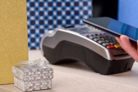 Paying for gifts with phoneの写真素材