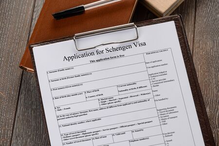 Filling an application to get a Schengen visaの写真素材