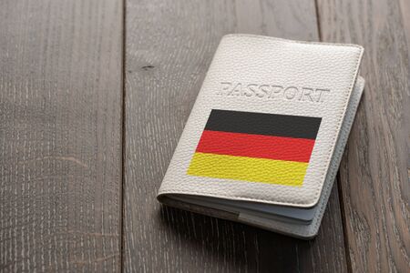 Close up on a German passport on wooden backgroundの写真素材