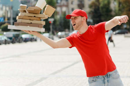 Delivery man is dropping boxes. Unpleasant moment of his job