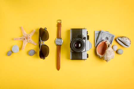 Travelers accessories, money and seashells. Trip to the seasideの写真素材