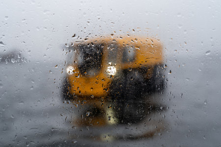 View on a yellow all-terrain vehicle through misted glassの写真素材