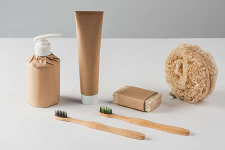 Set of shampoo, toothpaste, handmade soap, loofah sponge and toothbrushesの写真素材