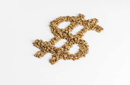 Perspective view on dollar sign made from pieces of gold on white backgroundの写真素材