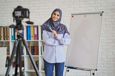 Muslim business woman making a video with a lectureの写真素材