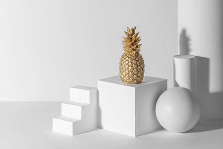 Golden pineapple decoration among 3d paper figuresの写真素材