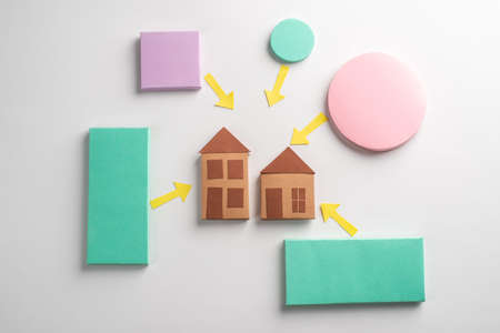 Rectangles and circles with pointing arrows at two housesの写真素材