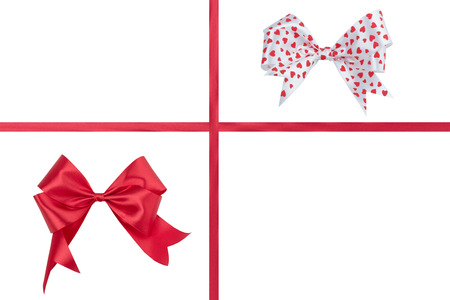 Red bow with a ribbon on a white .の写真素材