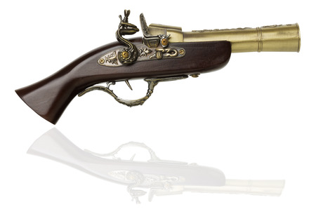 Old gun isolated on white