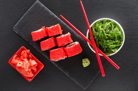 rolls and sea salad on a slate table.の写真素材