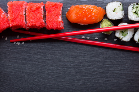 sushi and rolls on a slate table.の写真素材