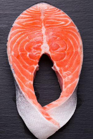 red fish steak on a slate table.の写真素材