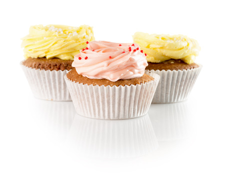 cupcakes with cream isolated on the white background.の写真素材
