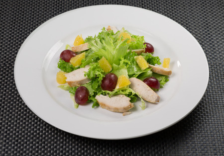 salad with grapes and chicken slices.の写真素材