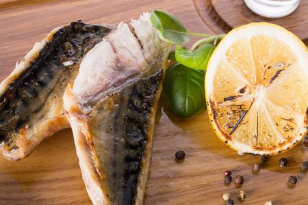 grilled mackerel on wooden background.