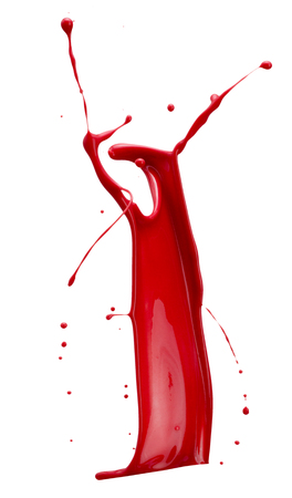 red paint splash isolated on a white background.の写真素材