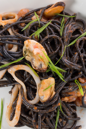 noodles with seafood on a plate.の写真素材