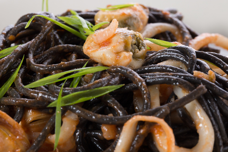 noodles with seafood on a plate.の写真素材