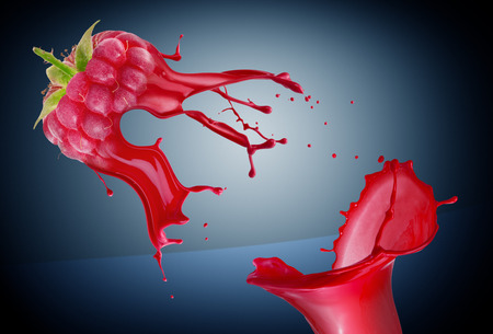 raspberry with paint splash on gray background.