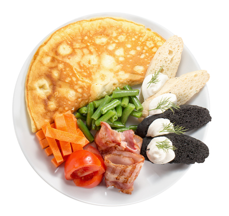 egg pancake with vegetables and ham slices.の写真素材