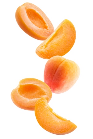 falling peaches slices isolated on a white background.の写真素材