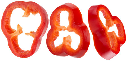 set of red bell pepper slices isolated on a white background.の写真素材