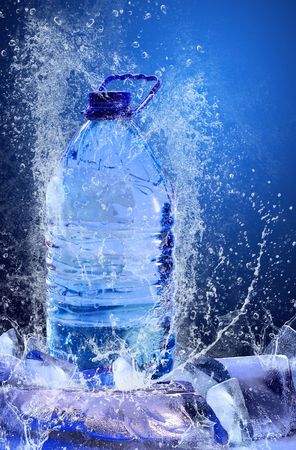 Buttle of water on the ice. Splash of waterの写真素材