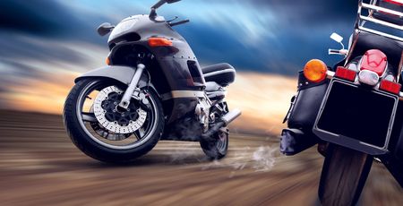 Two motorcycles on the speed on outdoor road