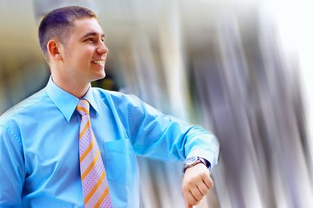 Happiness businessman on blur business architecture backgroundの写真素材