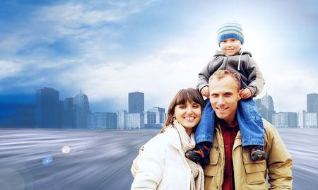 Happy family portrait outdoors smiling on the road in city の写真素材