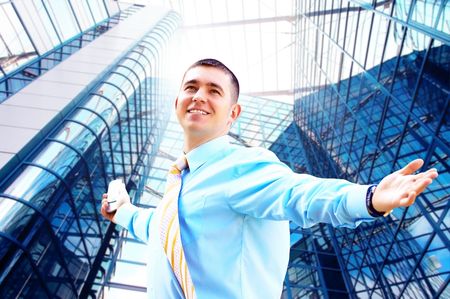 Hapiness Businessman standing on the business backgroundの写真素材