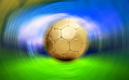 Soccer ball on the blur stadium backgroundの写真素材