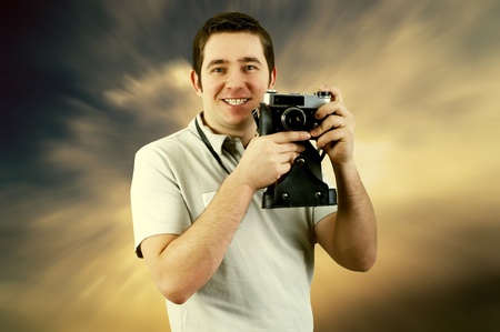 Happiness man with vintage photo cameraの写真素材