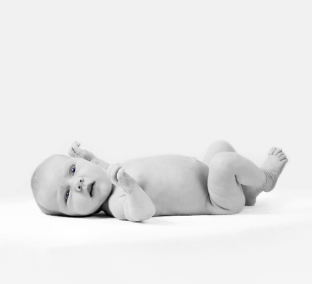 Newborn baby on the light backgroundの写真素材