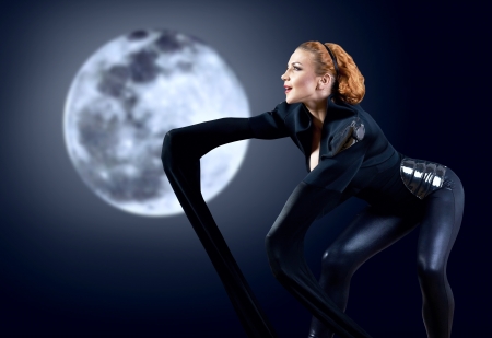 Woman dancer stay posing on backgroundの写真素材