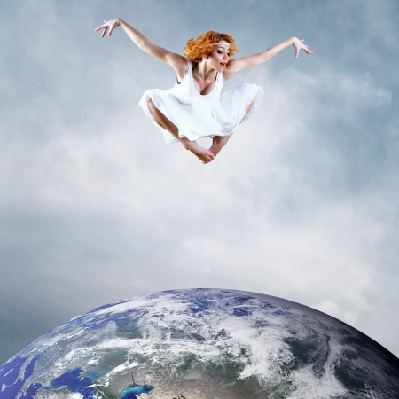 Jump of ballerina with dress of milkの写真素材