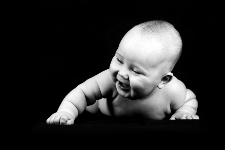 Four months baby on the dark backgroundの写真素材