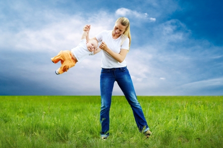 Mother and son funning outdoorsの写真素材